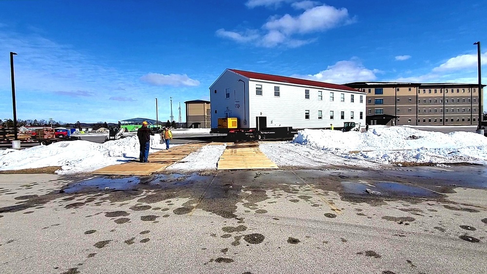 Contractors move second World War II-era barracks building at Fort McCoy