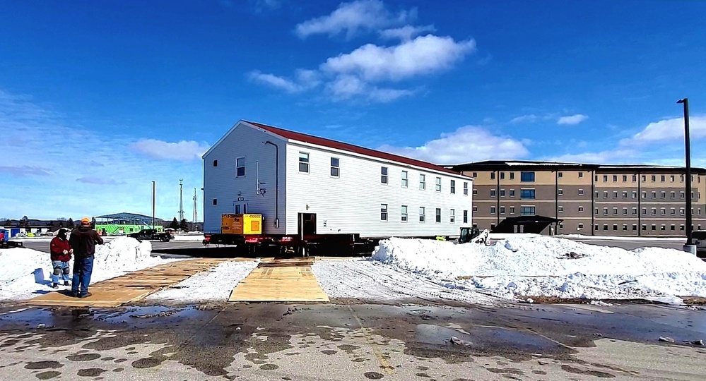 Contractors move second World War II-era barracks building at Fort McCoy