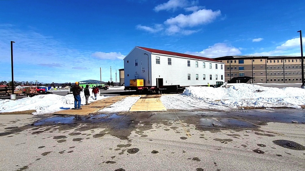 Contractors move second World War II-era barracks building at Fort McCoy