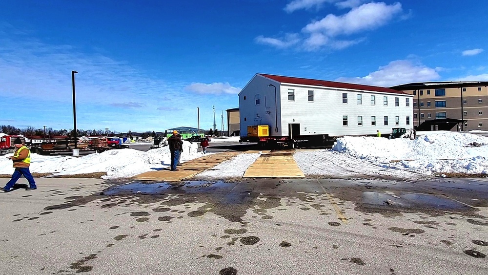 Contractors move second World War II-era barracks building at Fort McCoy