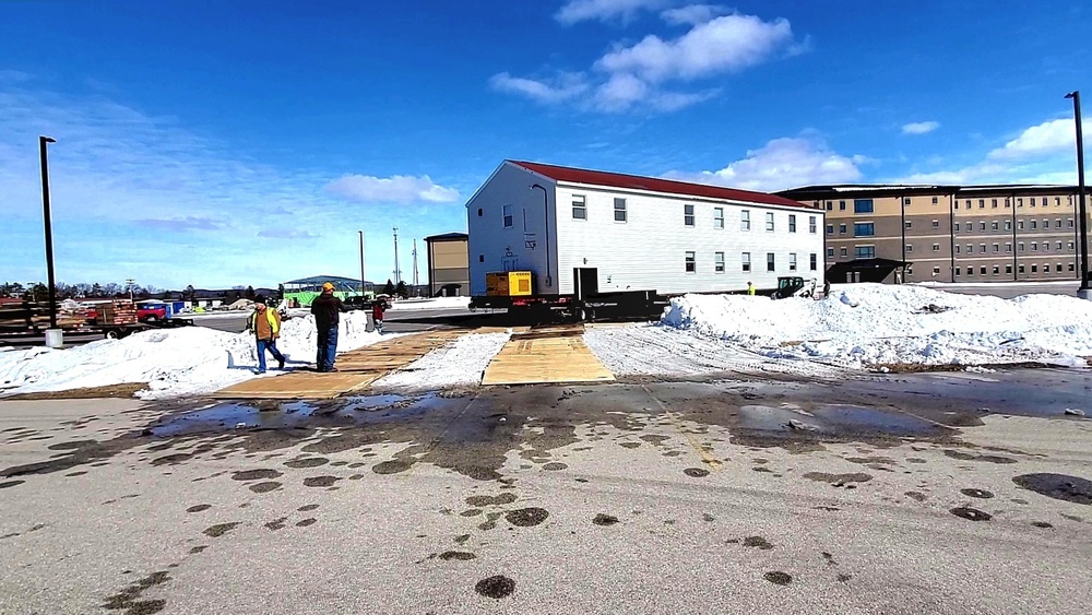 Contractors move second World War II-era barracks building at Fort McCoy