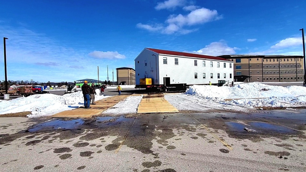 Contractors move second World War II-era barracks building at Fort McCoy