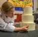 Chief Warrant Officer 2 Christine Stanley puts finishing touches on her cake