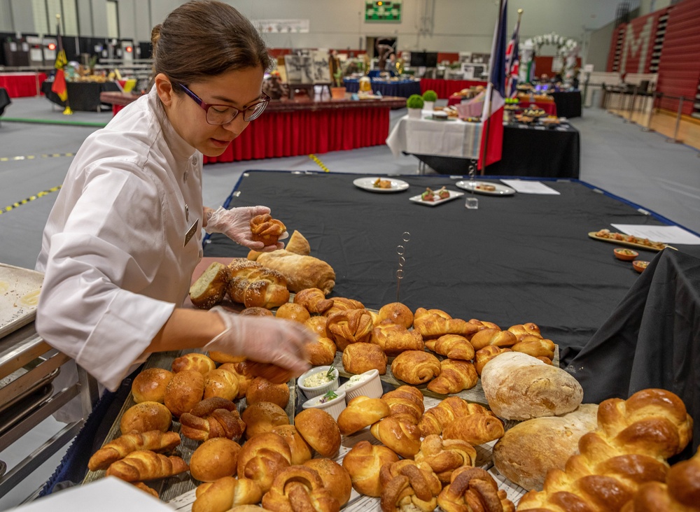 Warrant Officer 1 Daniella Blanco sets up a bread display