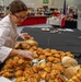 Warrant Officer 1 Daniella Blanco sets up a bread display