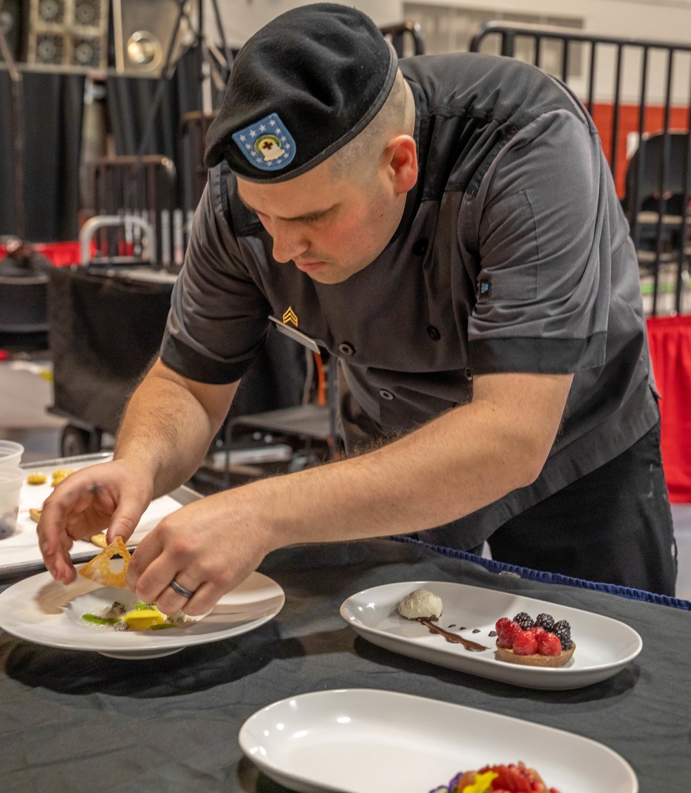 Sgt. Steven Philipps puts finishing touches on his dessert display