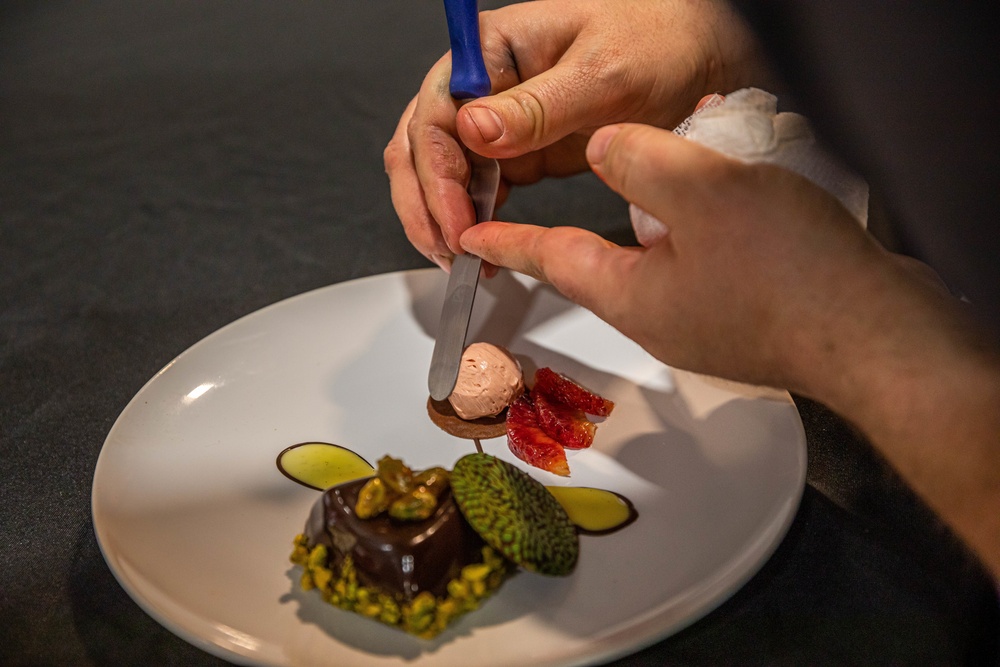 Sgt. Steven Philipps puts finishing touches on his dessert display