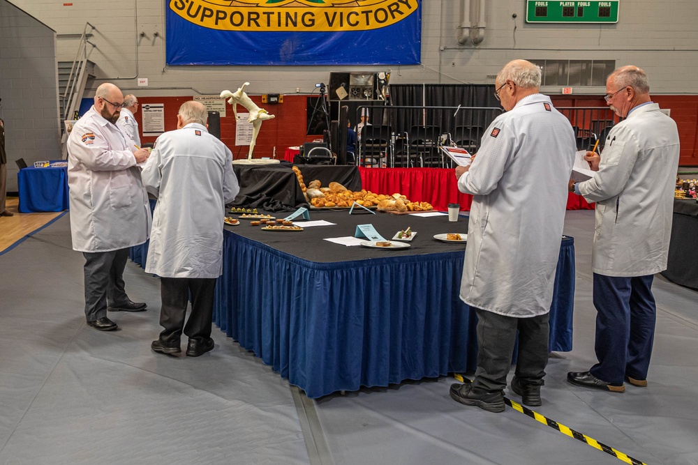 Judges assess the cold table displays