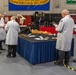 Judges assess the cold table displays