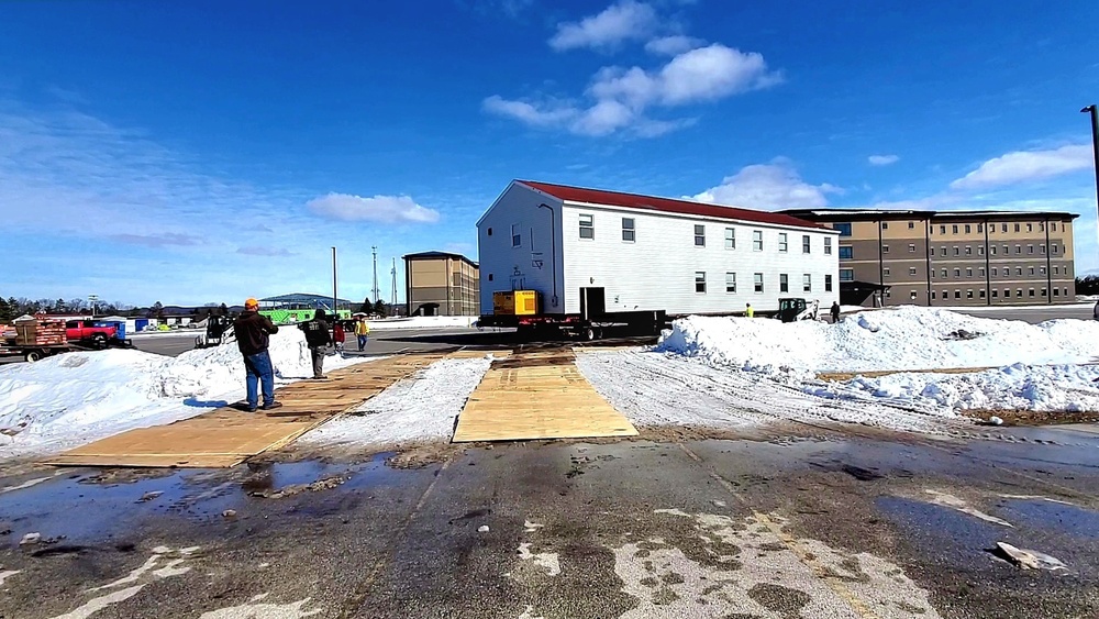 Contractors move second World War II-era barracks building at Fort McCoy