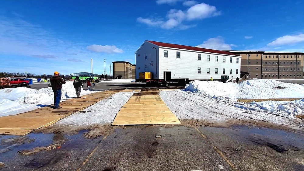 Contractors move second World War II-era barracks building at Fort McCoy