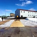 Contractors move second World War II-era barracks building at Fort McCoy