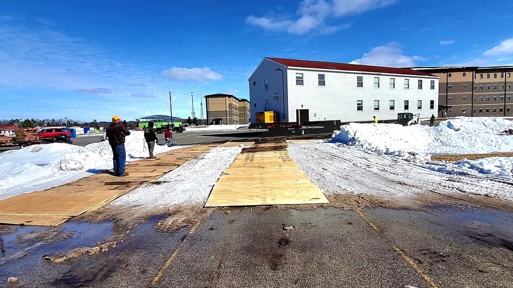 Contractors move second World War II-era barracks building at Fort McCoy