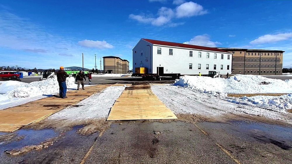 Contractors move second World War II-era barracks building at Fort McCoy