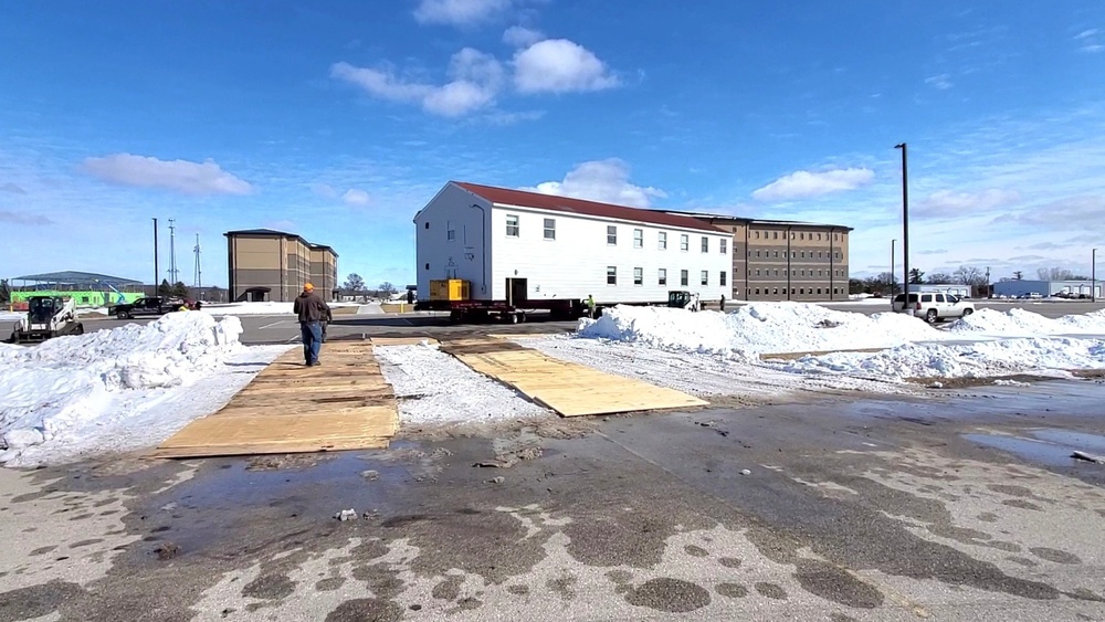 Contractors move second World War II-era barracks building at Fort McCoy