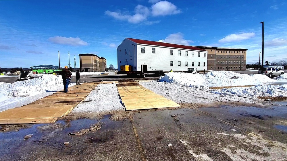 Contractors move second World War II-era barracks building at Fort McCoy