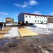 Contractors move second World War II-era barracks building at Fort McCoy