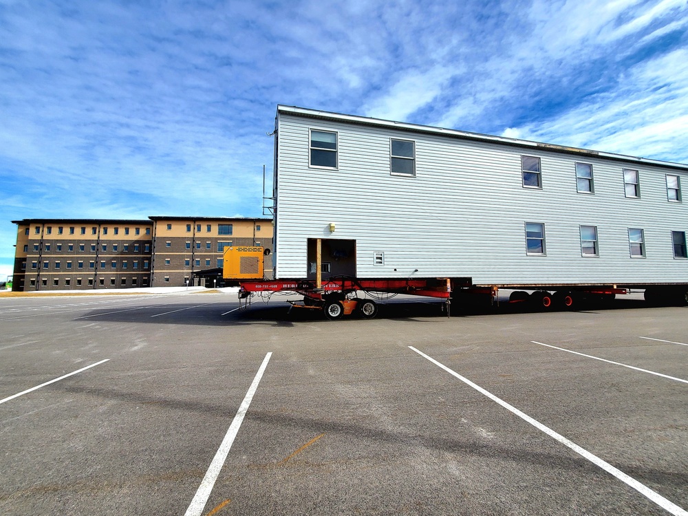 Contractors move second World War II-era barracks building at Fort McCoy