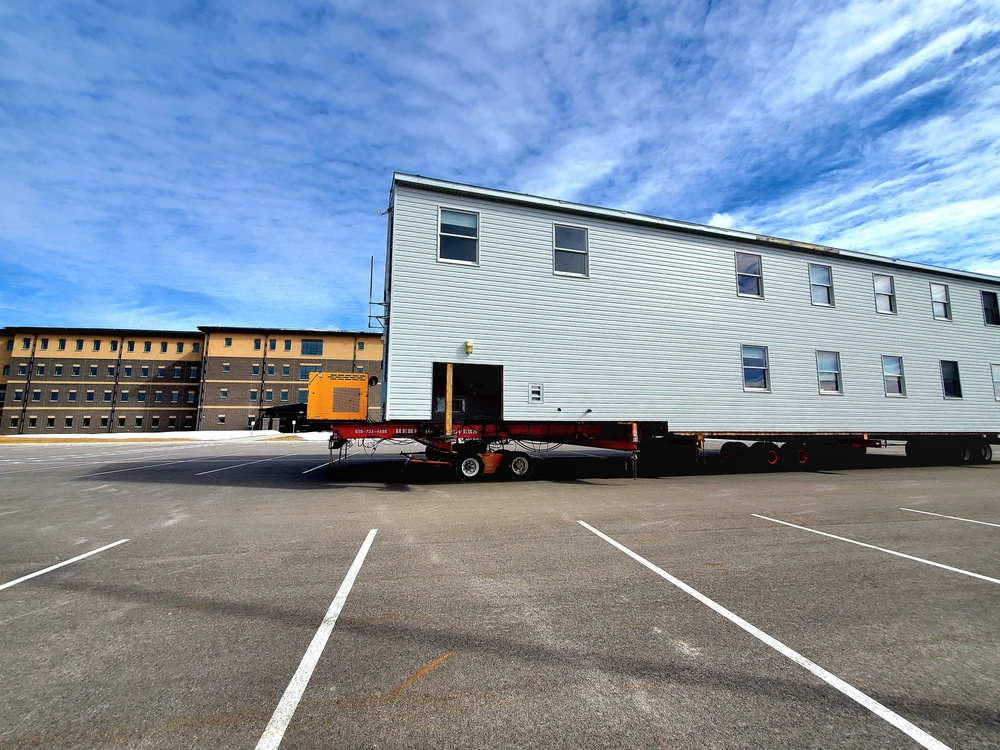 Contractors move second World War II-era barracks building at Fort McCoy