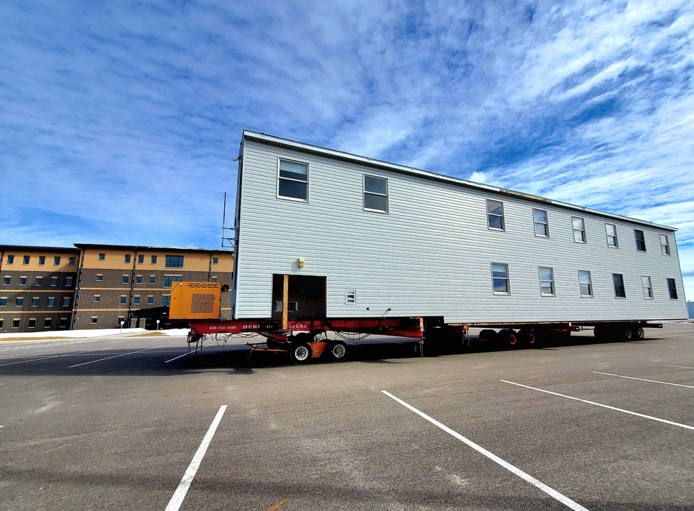 Contractors move second World War II-era barracks building at Fort McCoy