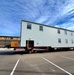 Contractors move second World War II-era barracks building at Fort McCoy