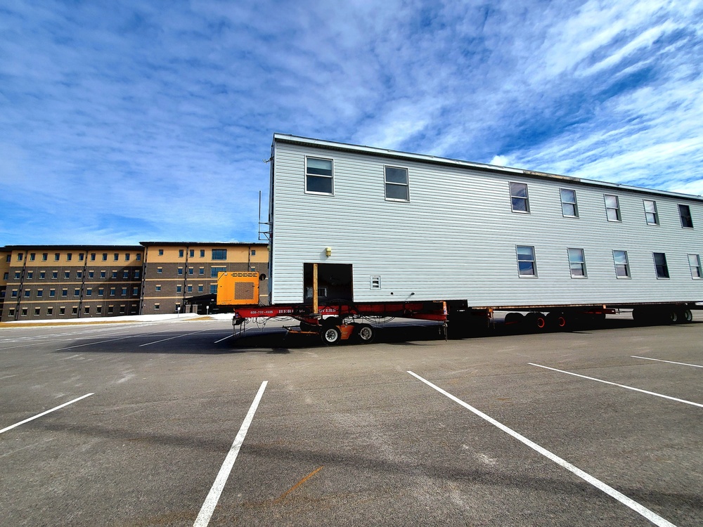 Contractors move second World War II-era barracks building at Fort McCoy