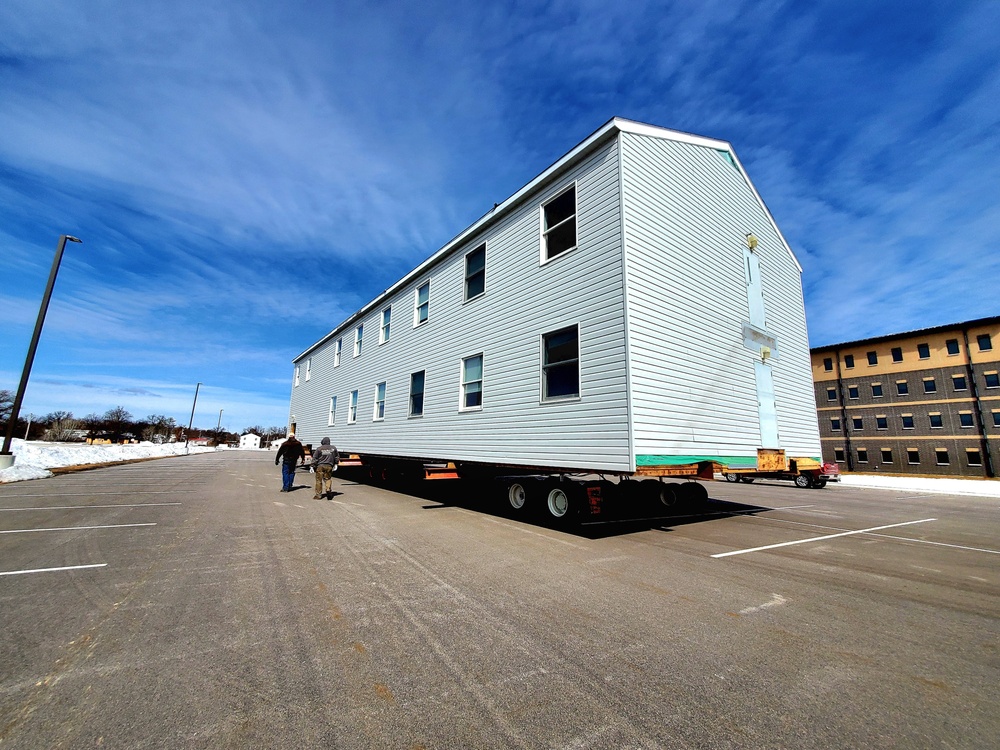 Contractors move second World War II-era barracks building at Fort McCoy