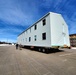 Contractors move second World War II-era barracks building at Fort McCoy