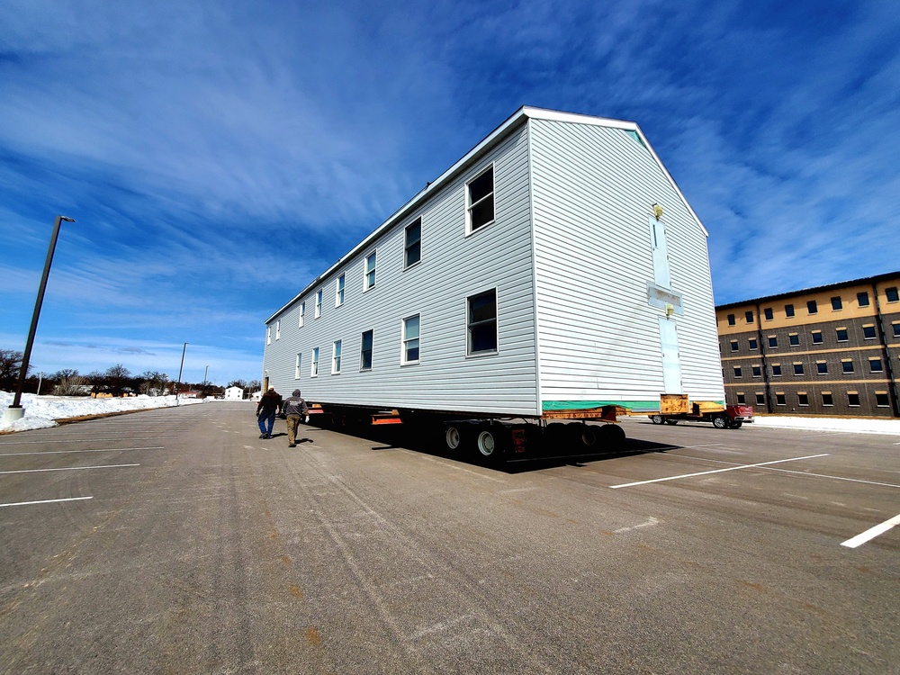 Contractors move second World War II-era barracks building at Fort McCoy