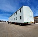 Contractors move second World War II-era barracks building at Fort McCoy