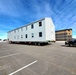 Contractors move second World War II-era barracks building at Fort McCoy