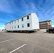 Contractors move second World War II-era barracks building at Fort McCoy