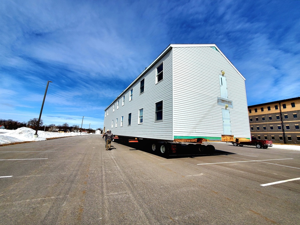 Contractors move second World War II-era barracks building at Fort McCoy