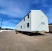 Contractors move second World War II-era barracks building at Fort McCoy