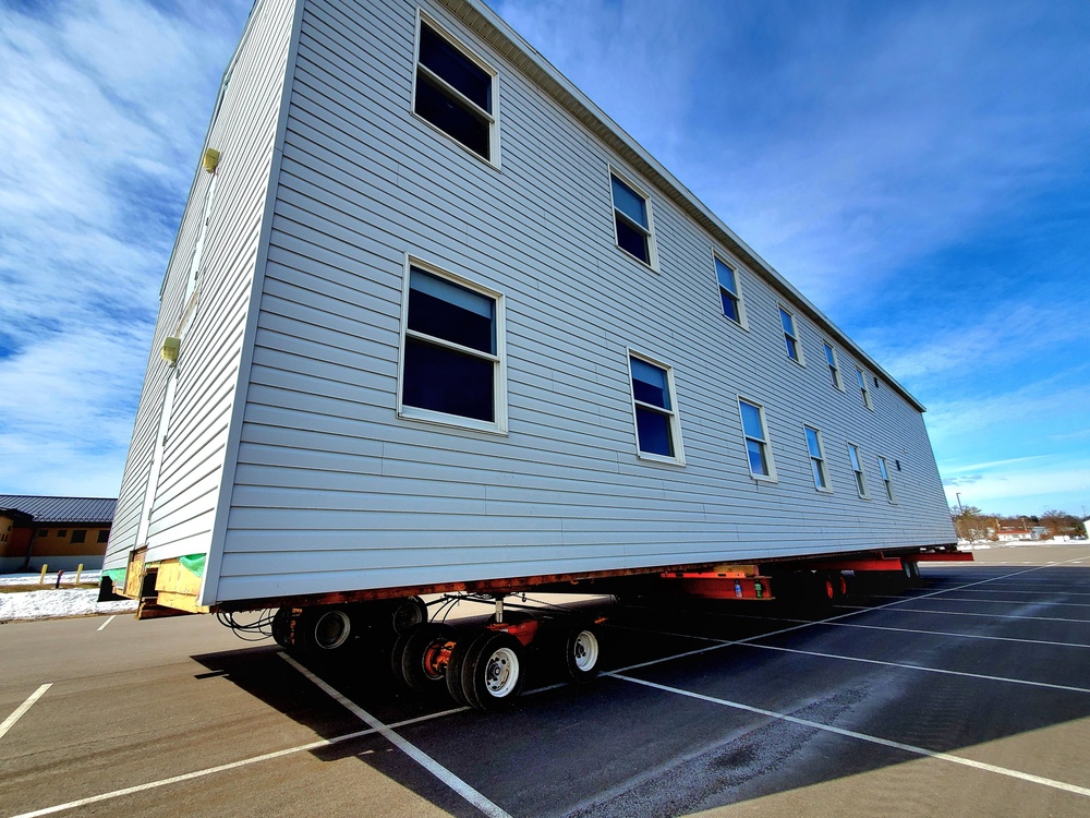 Contractors move second World War II-era barracks building at Fort McCoy