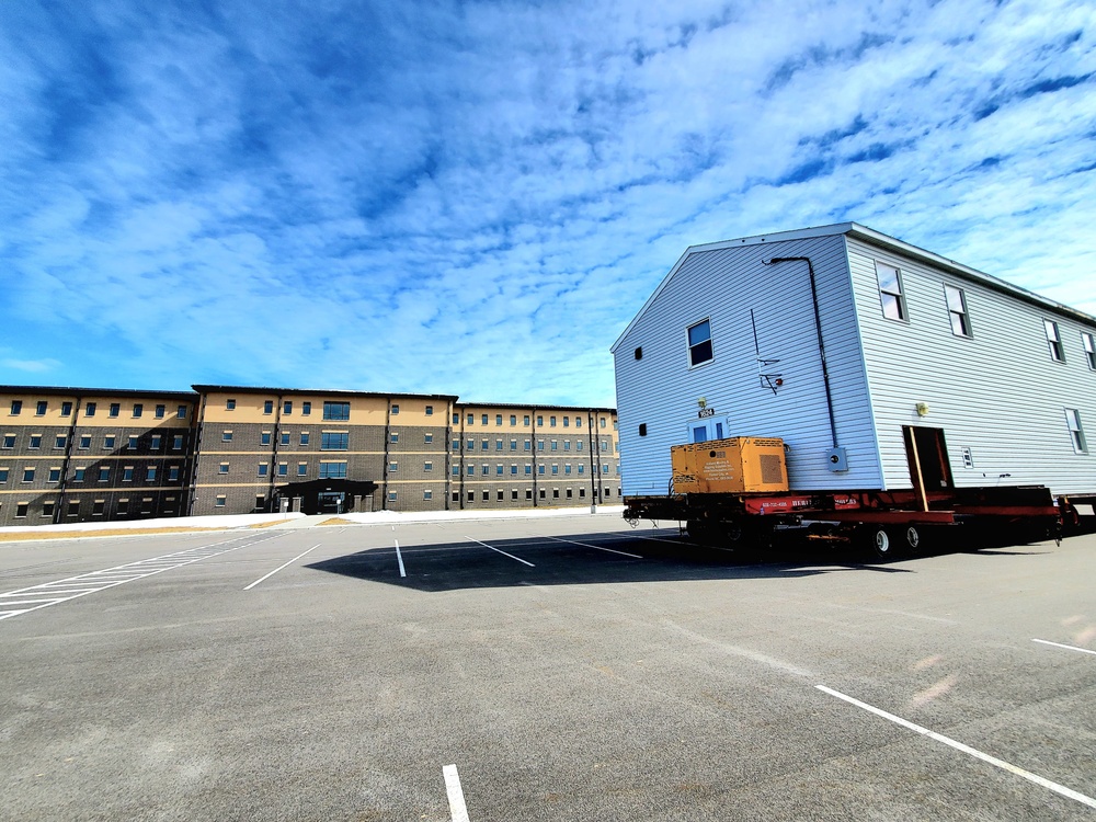 Contractors move second World War II-era barracks building at Fort McCoy