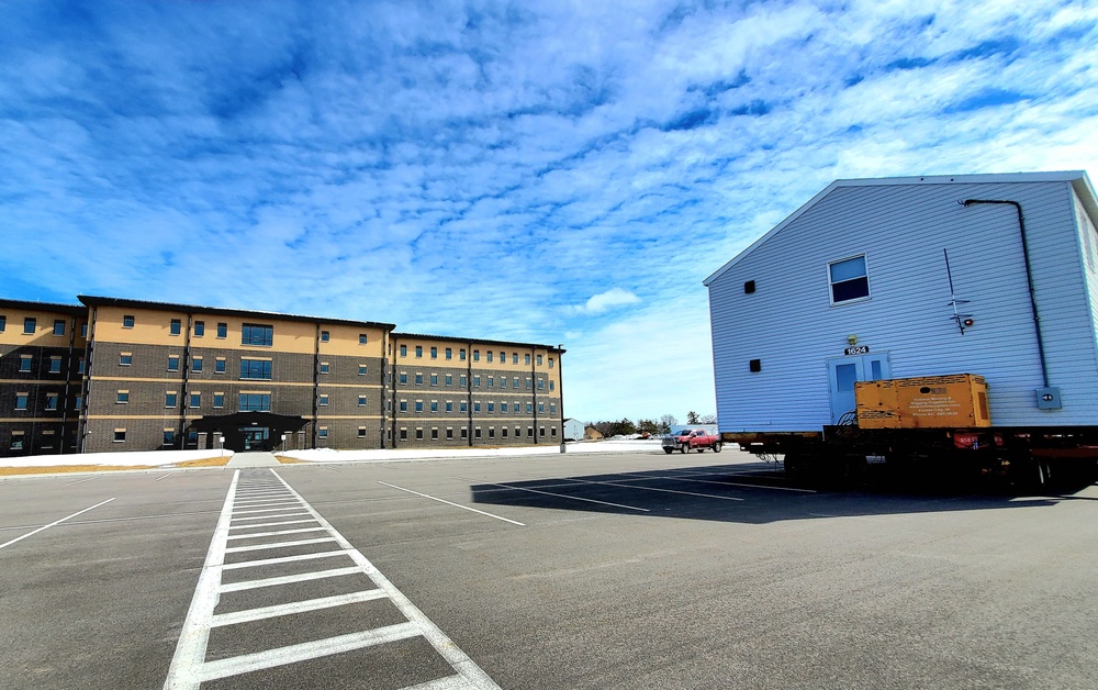 Contractors move second World War II-era barracks building at Fort McCoy