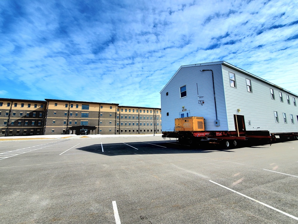 Contractors move second World War II-era barracks building at Fort McCoy