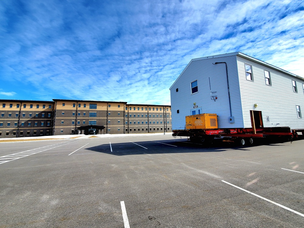 Contractors move second World War II-era barracks building at Fort McCoy