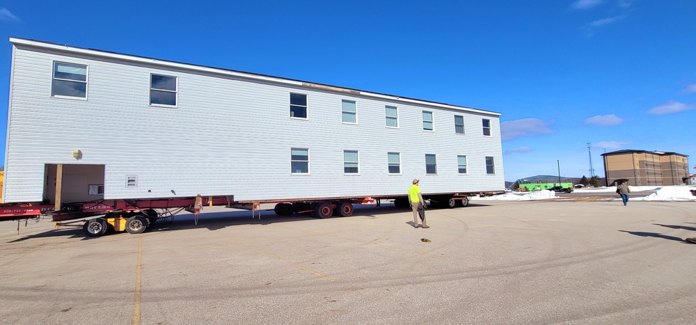 Contractors move second World War II-era barracks building at Fort McCoy