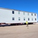 Contractors move second World War II-era barracks building at Fort McCoy