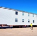 Contractors move second World War II-era barracks building at Fort McCoy