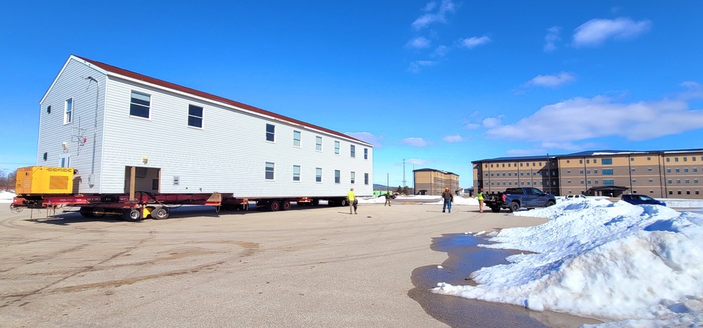 Contractors move second World War II-era barracks building at Fort McCoy