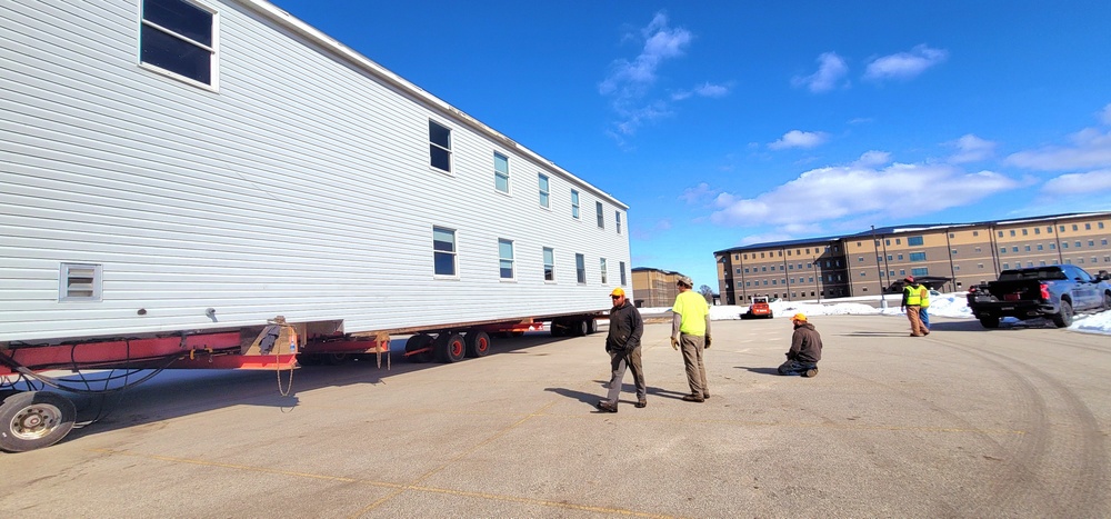 Contractors move second World War II-era barracks building at Fort McCoy