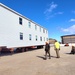 Contractors move second World War II-era barracks building at Fort McCoy