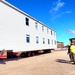 Contractors move second World War II-era barracks building at Fort McCoy