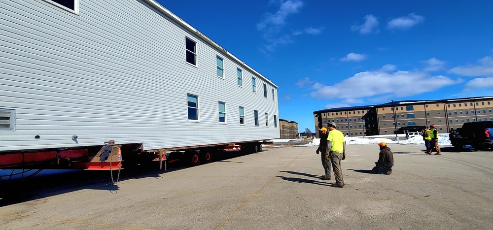 Contractors move second World War II-era barracks building at Fort McCoy