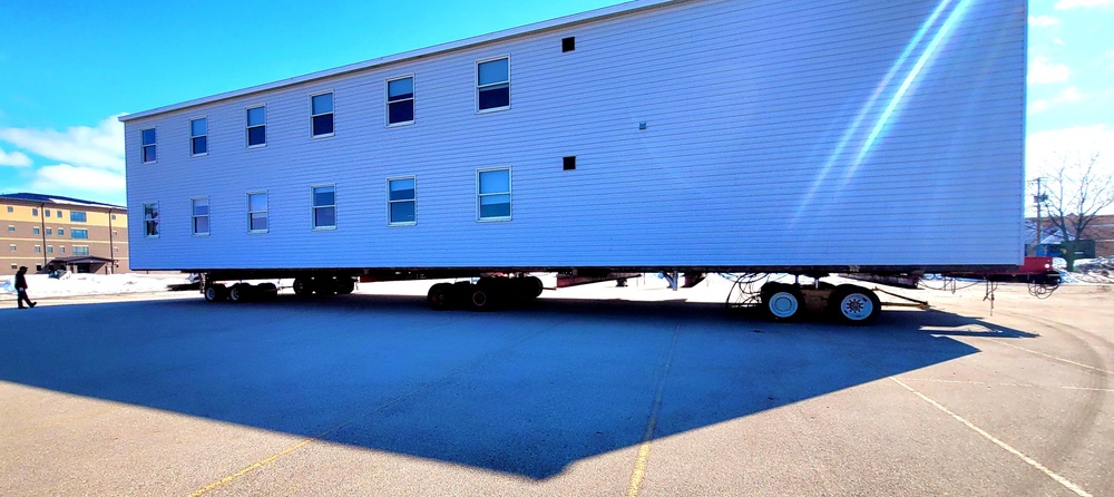 Contractors move second World War II-era barracks building at Fort McCoy