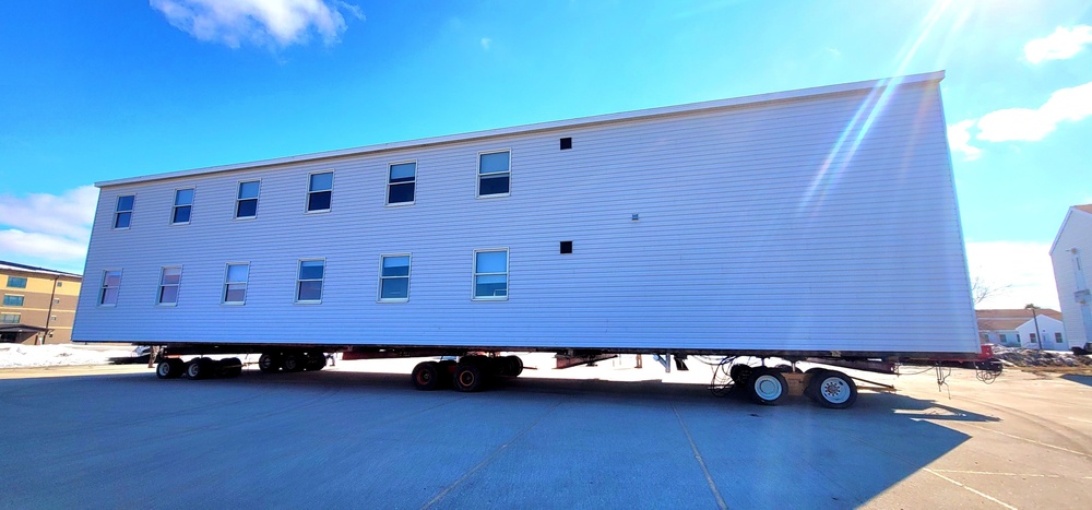 Contractors move second World War II-era barracks building at Fort McCoy