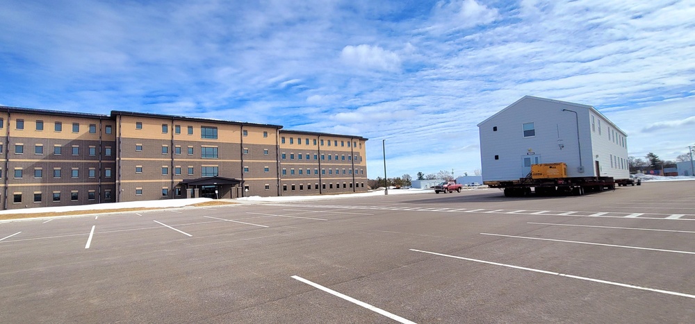 Contractors move second World War II-era barracks building at Fort McCoy